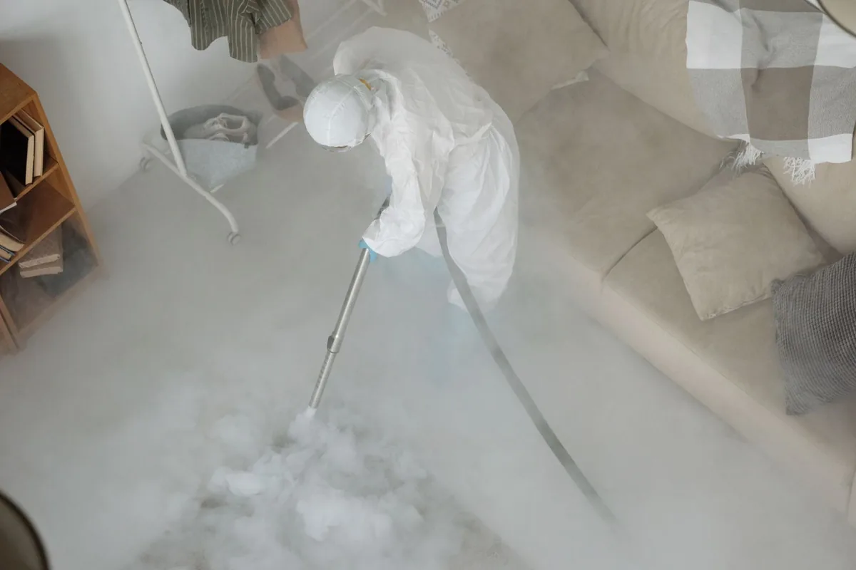 Biohazard cleanup technician in protective equipment, Bolivar, WV